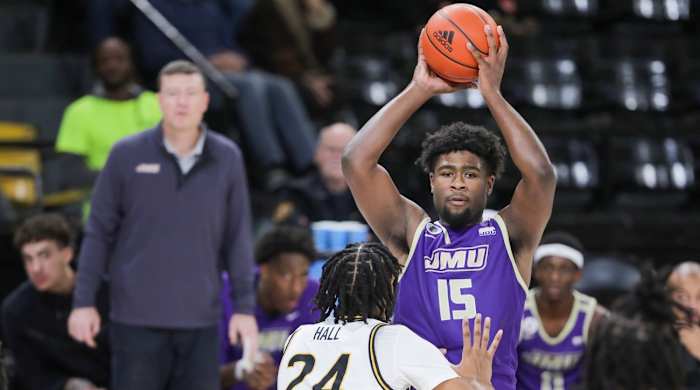 James Madison Dukes forward Jaylen Carey (15) looks to pass over Southern Miss Golden Eagles forward Bryson Hall (24) during the second half at Reed Green Coliseum in Hattiesburg, Mississippi, on Jan. 6, 2024.
